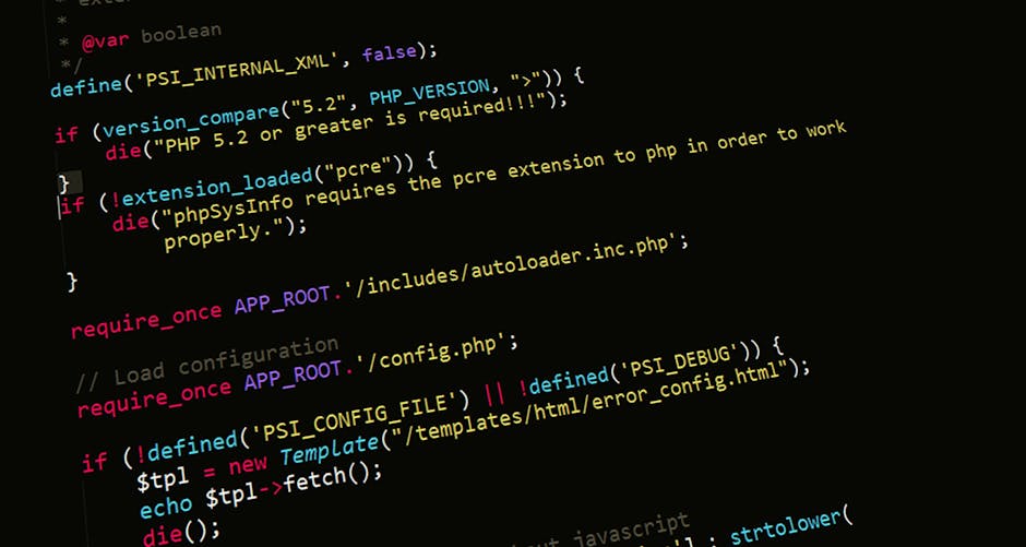 The image displays a close-up of a computer screen showing lines of code in a text editor with syntax highlighting in colors such as pink, blue, yellow, and white. The code appears to be PHP programmi