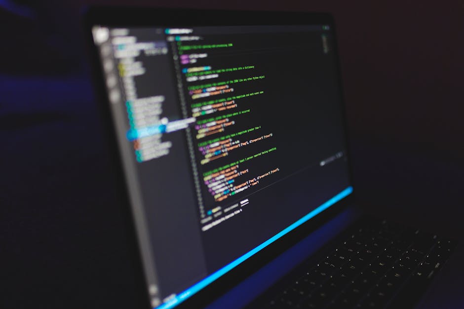 The image displays a close-up of a computer screen showing lines of code in a text editor with syntax highlighting in colors such as pink, blue, yellow, and white. The code appears to be PHP programmi
